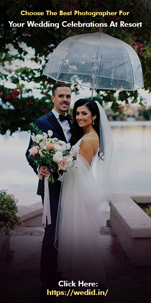 A couple in their wedding costumes with flower bouquet in hand posing for a photos by Best Photographer.